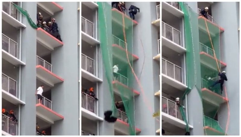 video of to save the woman who is trying to jump down from the building goes viral bkg 