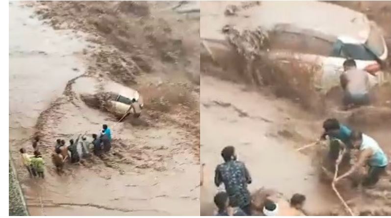 Monsoon Update Woman rescued from submerged car after flash flood in Haryana Video goes viral ckm