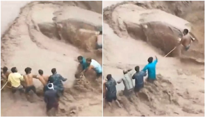 woman rescued from a submerged car in haryana the video going viral hyp