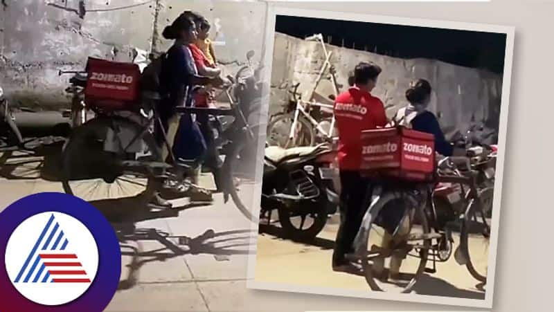 Wife Of Zomato Delivery Boy Seen Carrying His Bicycle And Walking Along With Him People Appreciate Her Efforts  roo