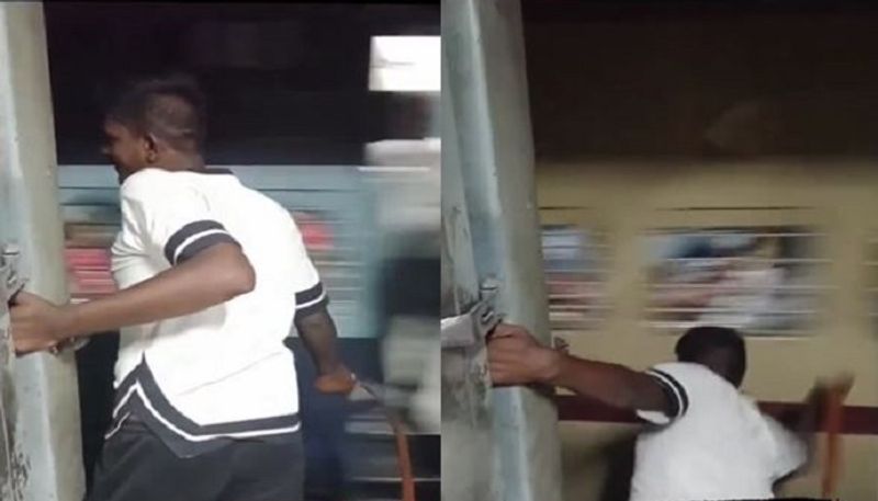 Man Hitting Passengers Of Another Moving Train With Belt, Railways Initiates Action, Video Goes Viral - bsb