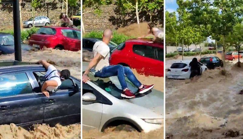 WATCH Cars swept away, residents stranded as torrential rains trigger flash floods in Spain's Zaragoza AJR