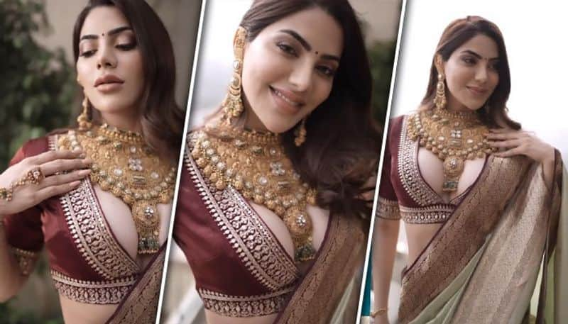 Nikki Tamboli gets trolled for flaunting cleavage in plunging neckline blouse, one said, 'Blouse Pehna Hi Kyu' RBA