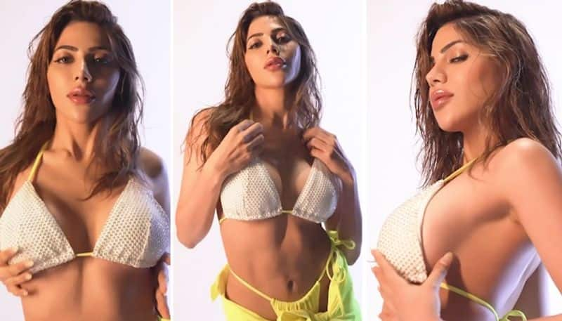 Nikki Tamboli HOT Photos: Actress raises temperature in white bikini and fluorescent skirt (PICTURES) vma