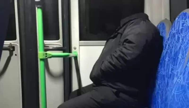 truth behind the viral photo in which a headless man sitting inside public transport hyp