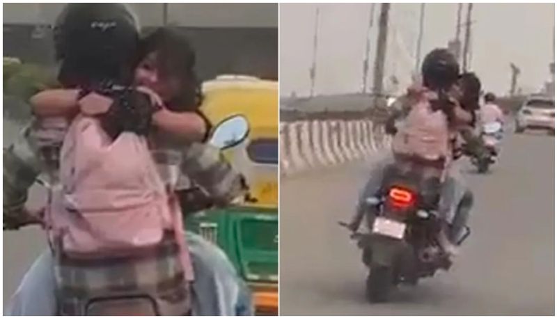 Couple Romancing On Speeding Bike women sits on bike fuel tank watch viral video btb