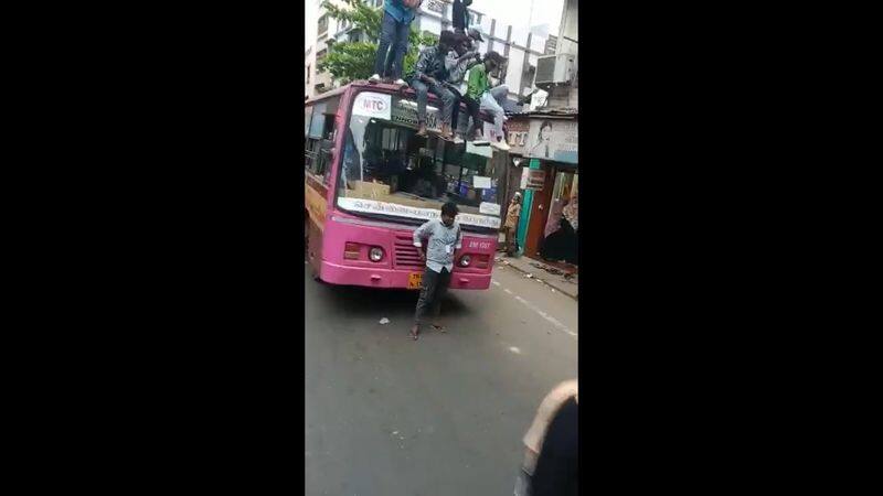 some college students travel in roof of government bus in chennai