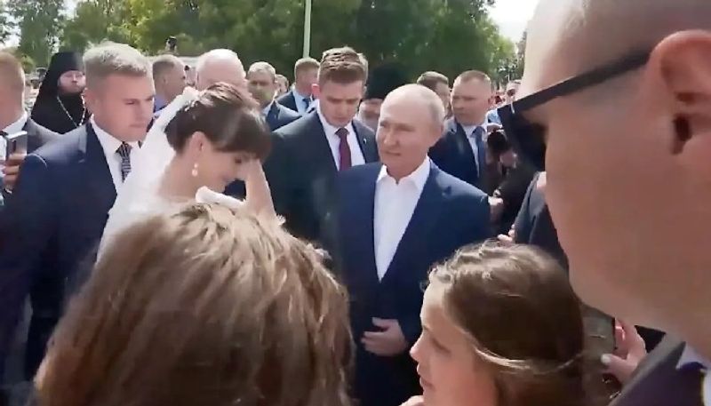 Picture with war criminal Bride's encounter with Vladimir Putin in Russia amid tensions goes viral (WATCH) snt