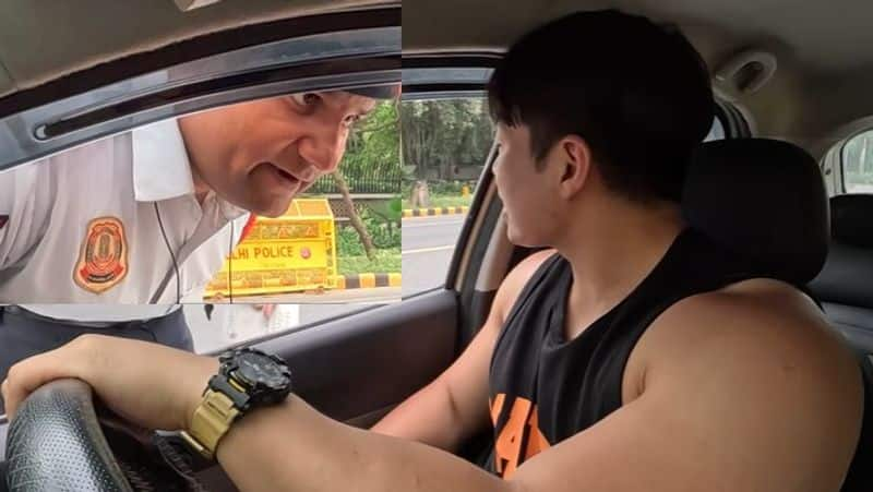 viral video Delhi traffic police suspended for extorting 5000 from a foreign vlogger akb