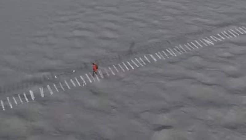 man walking on most dangerous bridge rlp