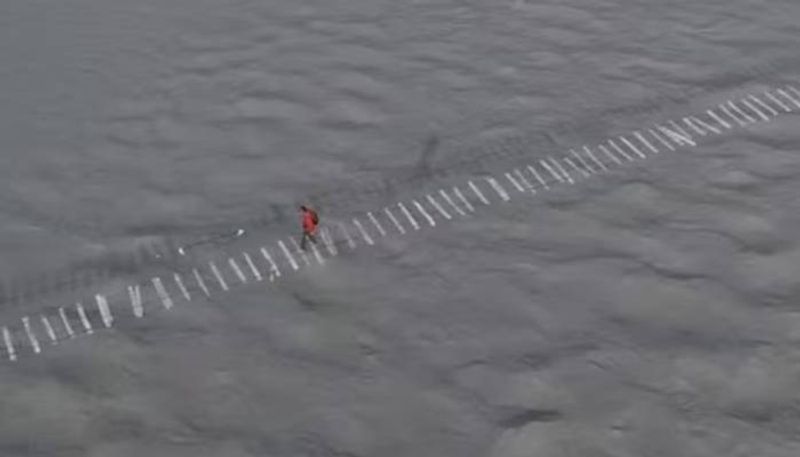 man walking on most dangerous bridge rlp