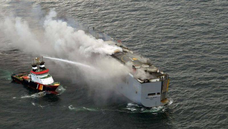 Freighter with 3000 vehicles is still on fire off Netherlands coast; spark in electric car likely cause