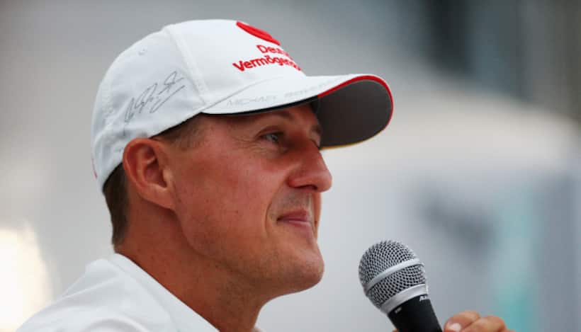 What does Michael Schumacher's rare public act for charity mean for F1 fans?