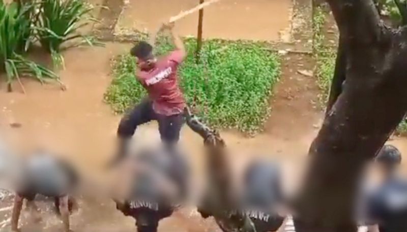 NCC cadets face down in muddy soil while raining and brutaly caned by senior video captured by college student invites huge criticism against NCC training method etj