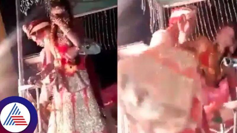 Groom falls with bride while trying to lift her in his arm on wedding stage Vin