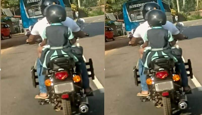 MVD Facebook post about a father and his daughter traveling on two wheeler with helmets in Kerala road prn