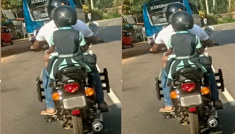 MVD Facebook post about a father and his daughter traveling on two wheeler with helmets in Kerala road prn