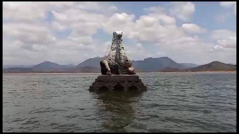 nandi statue visible at mettur dam for decreasing the water level in salem district