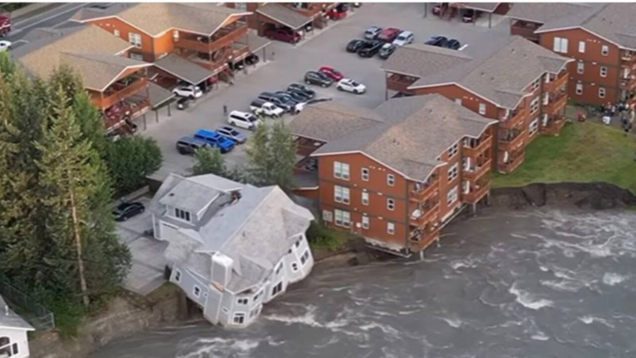 Cascade of destruction: Two storey house collapses into Alaska river amid record glacial flooding   WATCH