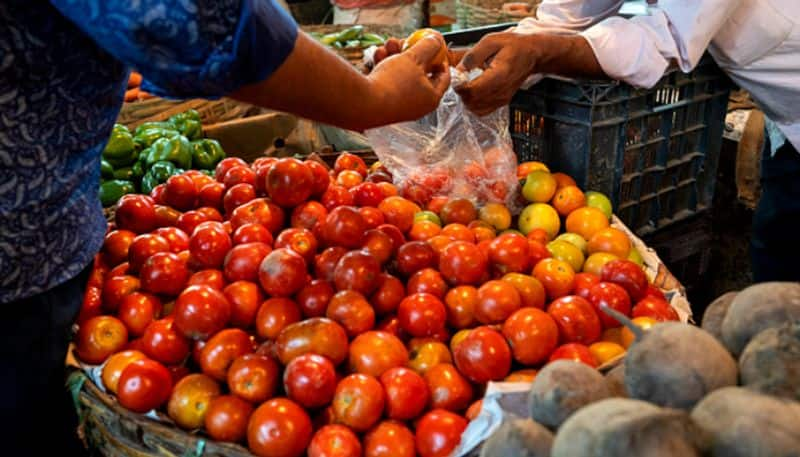 What is the price of tomato onion carrot and ginger in the vegetable market KAK