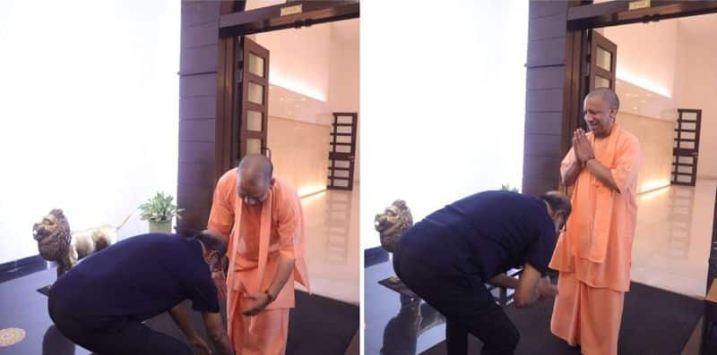 Why did Rajinikanth fall on Yogi Adithyanath's feet during the meeting?