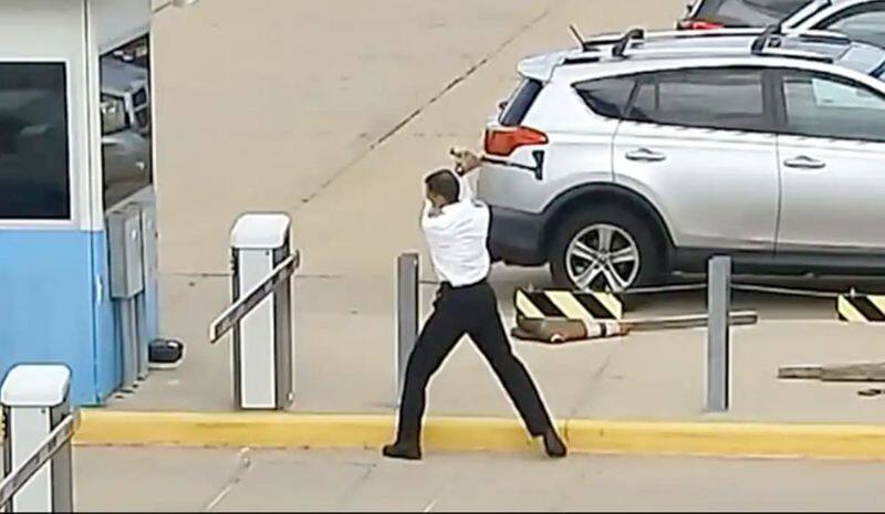 Caught on camera: United Airlines pilot smashes barrier gate with axe at Denver airport, charged - WATCH snt