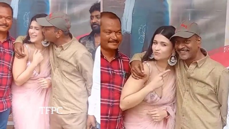 Director A S ravikumar Chowdary kissed Actress Mannara chopra at Thiragabadara Saami movie promotion video goes viral netizens slams Director behaviour akb