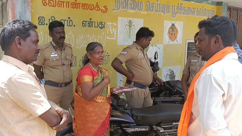 Hindu Munnani people protest against the hm who banned the girls from planting flowers in the government school in theni vel