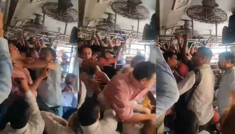 Opposite Delhi Metro, Mumbai local train, madly fighting for a seat.. Video viral  - bsb