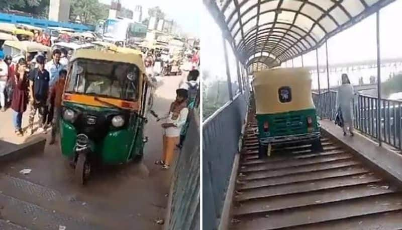 driver rides auto on foot over bridge because of  crowded road rlp