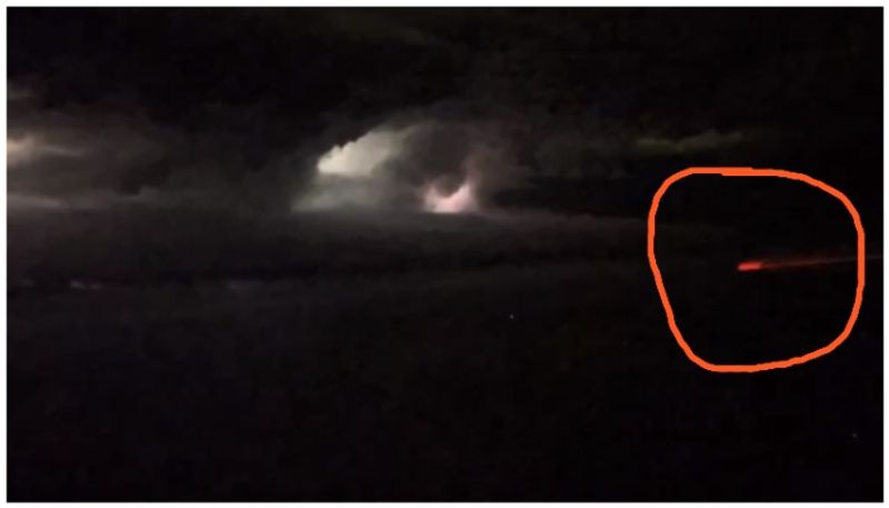 Scary video of red passenger plane like fireball in thunderstorm bkg 