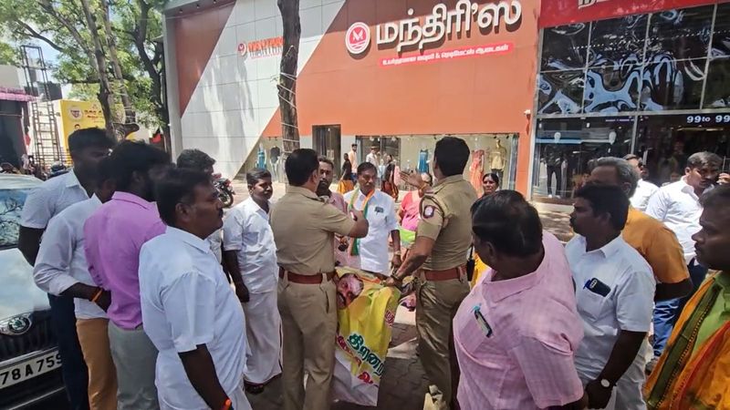 tn bjp workers did a begging protest against dmk government in tirupur district vel