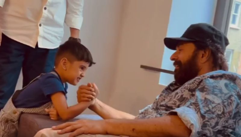  kunchacko boban son arm wrestling with mammootty video on his birthday nsn