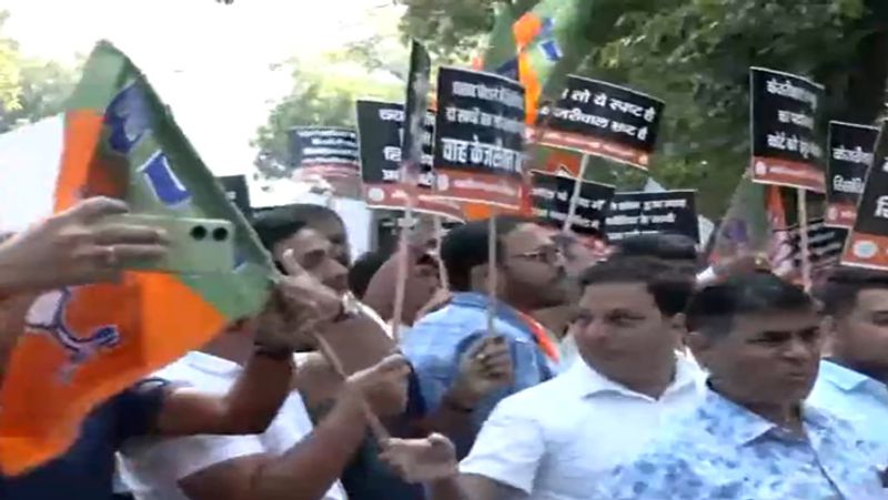 BJP workers demand Delhi CM Arvind Kejriwal resignation smp