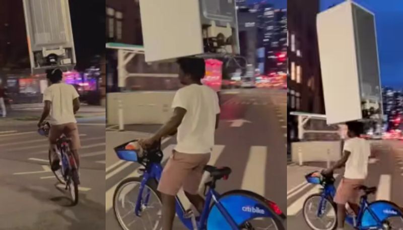 Viral Video Shows Man Carrying Fridge On Head While Cycling azn 