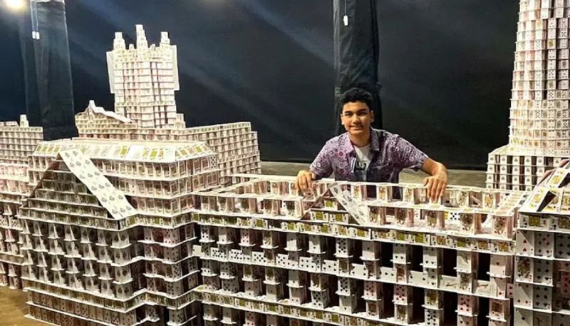 student made building model with play cards and got guinness world record hyp