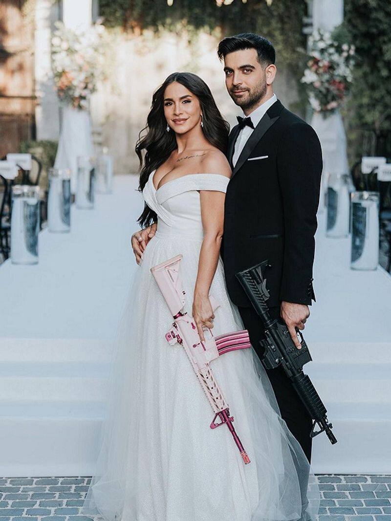 israel bride carries gun in wedding photo shoot  even groom supported him zrua