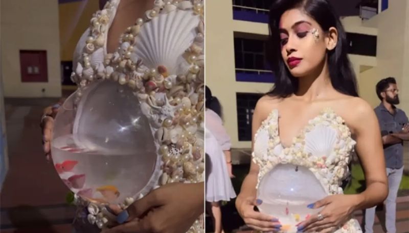 models gown with live fish going viral in social media hyp