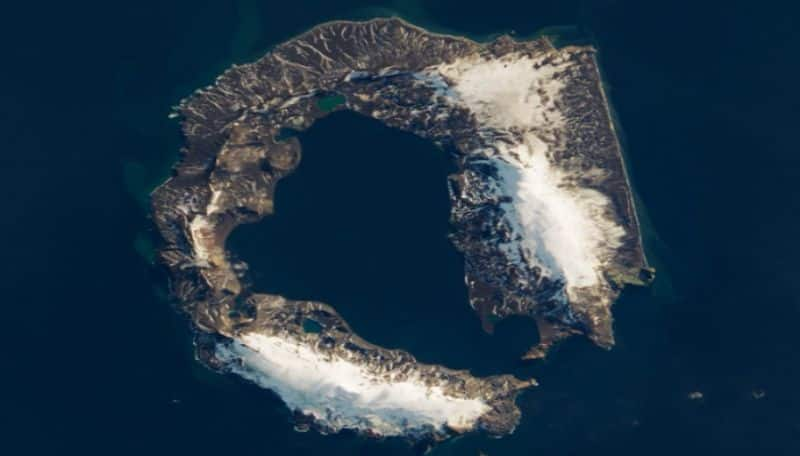 Nasa shares a stunning picture of a isolated island with active volcano from Antarctica peninsula ans 