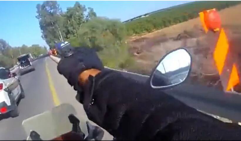 Dramatic! Israeli cop fires gun from moving bike in shootout with Hamas operatives amid war - WATCH