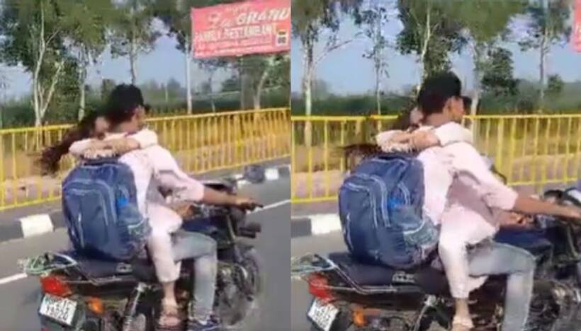 బైక్ పై యువ జంట రొమాన్స్.. ఒకరి కౌగిలిలో మరొకరు ఒదిగిపోతూ.. పోలీసులు ఏం చేశారంటే? (వీడియో)