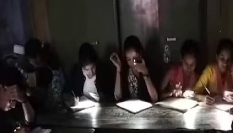 no electricity students writing exam in mobile flashlights  Bihar rlp