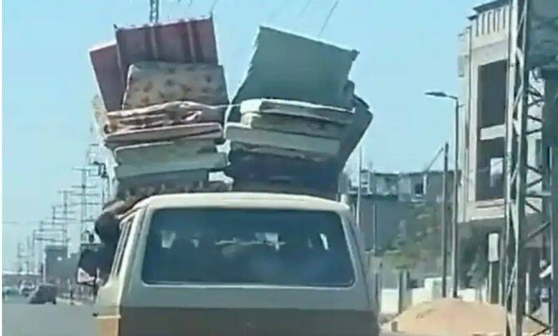 Gaza residents flee with mattresses strapped to cars after Israel's evacuation ultimatum (WATCH) snt