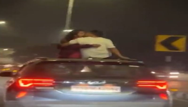 Hyderabad Video of couple kissing on moving car roof goes viral ksm