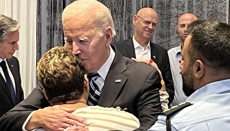 Viral photo Joe Biden hugs Israeli woman who tricked Hamas operatives with cookies coffee gcw