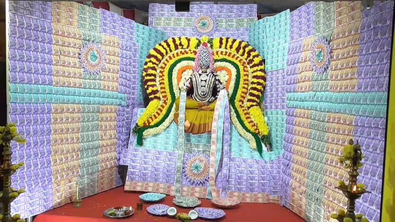 6th day of navaratri festival amman statue decorated by currency notes in vellore district vel