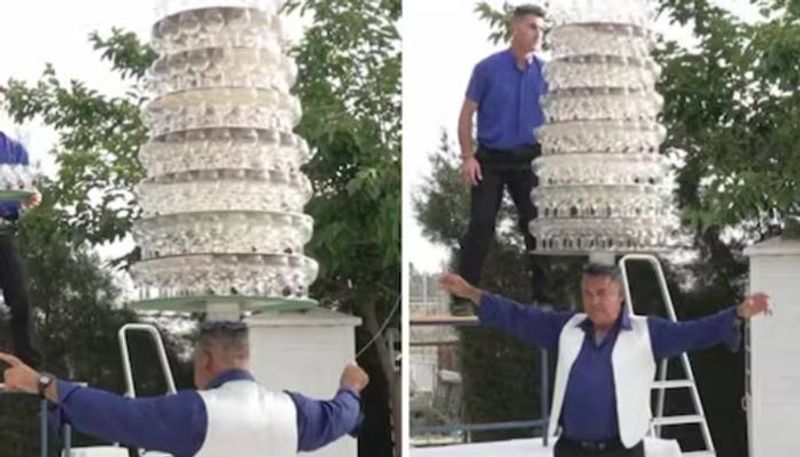 balancing 319 wine glasses in head man create world record rlp