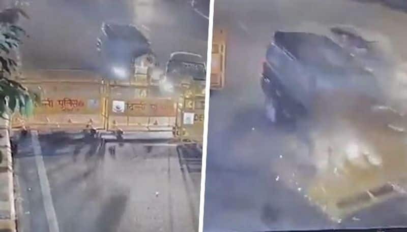 Caught on CCTV: Cop thrown into the air after speeding SUV rams into barricade (WATCH)