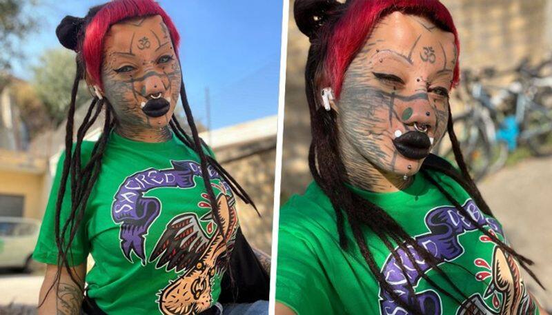 Shocking 22-year-old Italian woman gets 20 body modifications to transition into a cat; plans for more snt