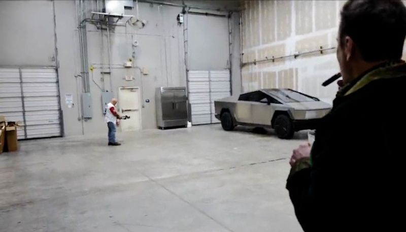 WATCH Elon Musk enjoys cigar as Joe Rogan tests Tesla Cybertruck's resilience with an arrow snt